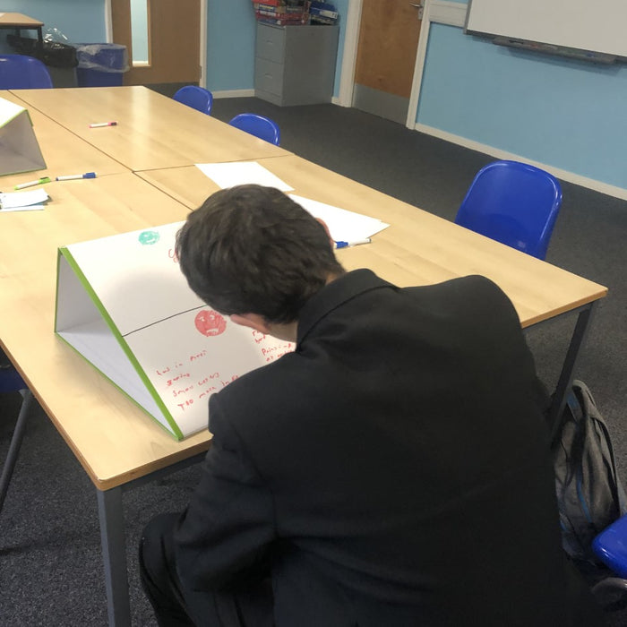 Special Educational Needs Department uses school tabletop whiteboard as a writing slope in lessons